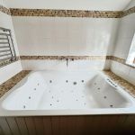 the jacuzzi bath in the master bedroom en suite.jpg